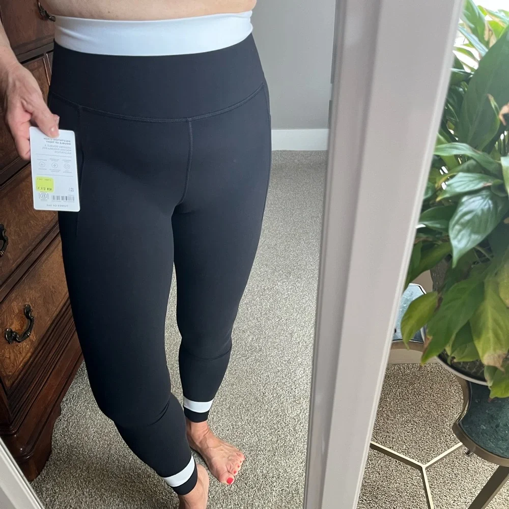 Athleta Black Leggings with White Waistband and Cuff Accents - Picture 1 of 6